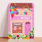Aniet Illustration, kaart A6 `Happy Birthday` roze voordeur slingers ballonnen